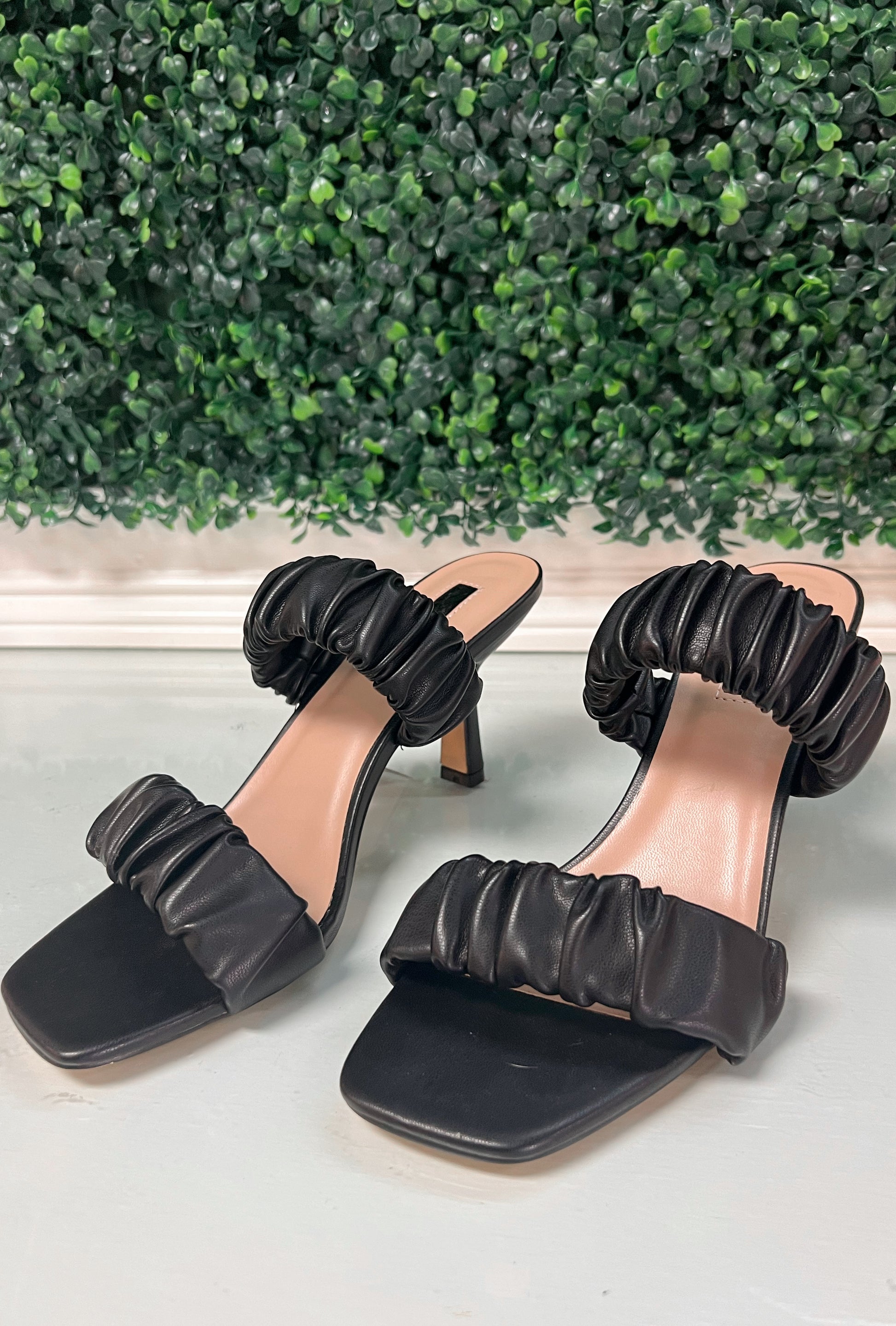 Black faux leather heels with ruffled thick straps
