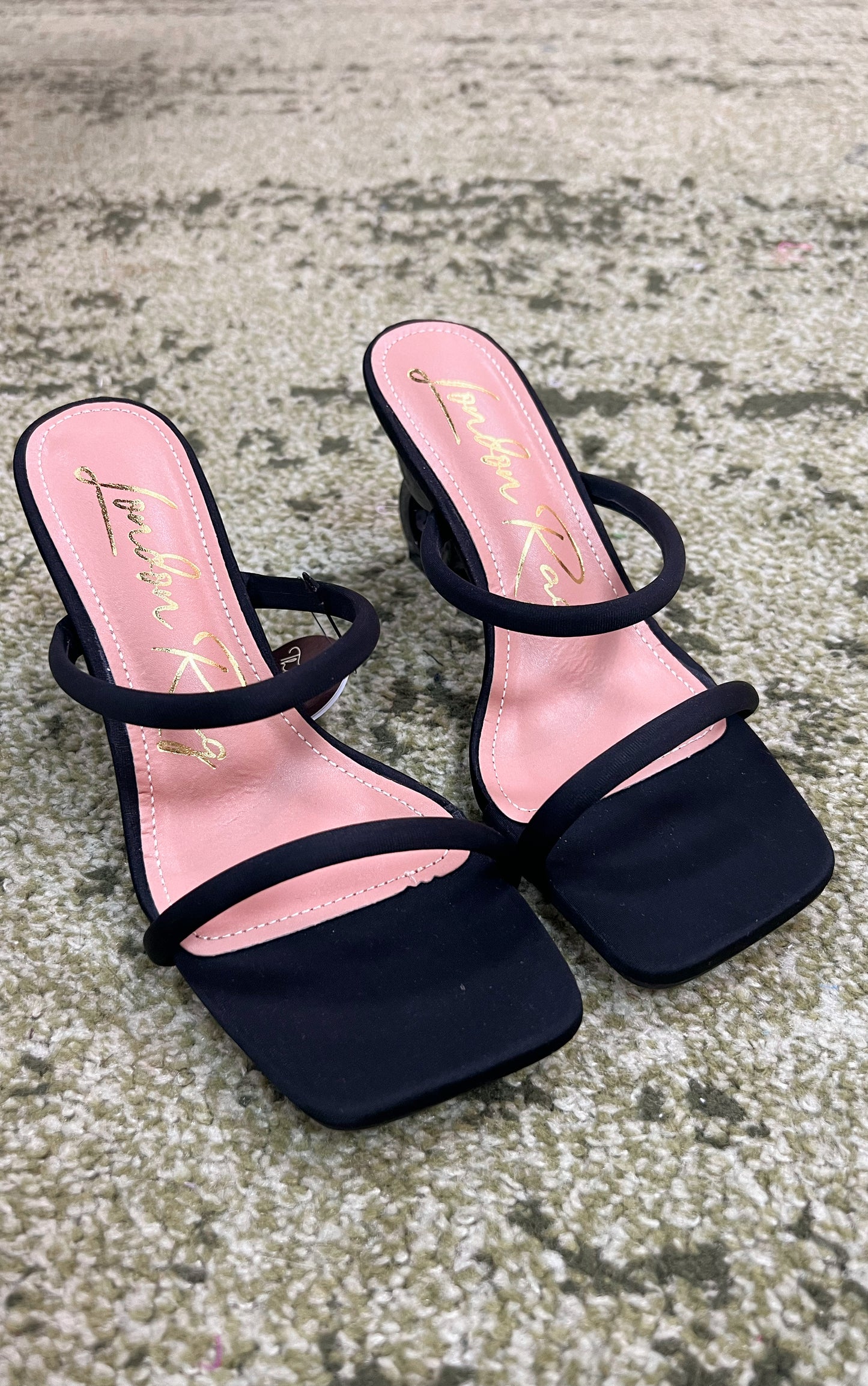 Black double strap mid-heeled sandal with a unique heel consisting of 2 interlocked circles